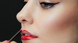 Mary Kay Lip Liner in Red being applied to model’s lips.
